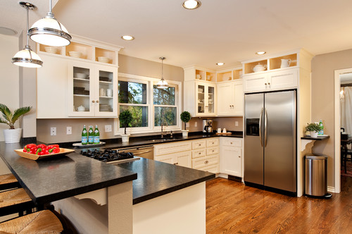 Black Granite Countertop Dark Wood Floor White Cabinetry Stainless Steel Appliances White Cabinets